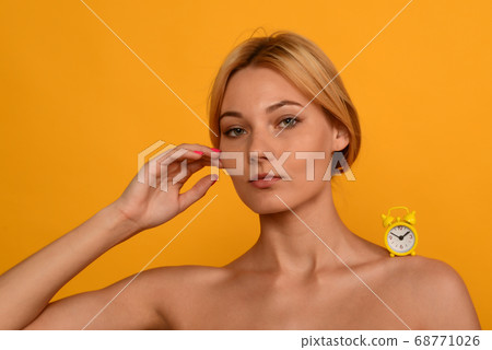 Portrait of a young beautiful girl with the clock Portrait of a young beautiful girl with the clock 68771026