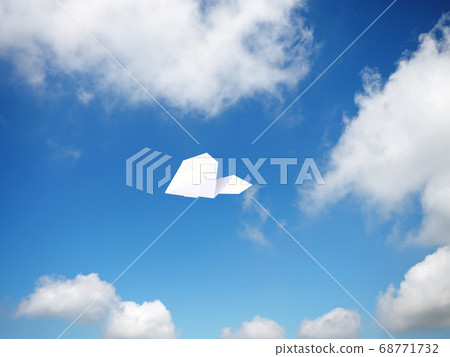 Paper airplane flying in the sky 68771732
