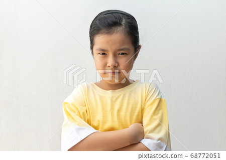 Unhappy or offended asian girl, isolated on white 68772051