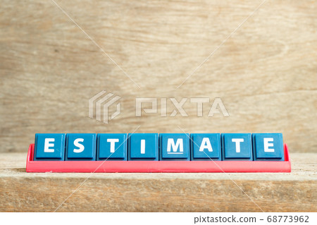 Tile letter on red rack in word estimate on wood background Tile letter on red rack in word estimate on wood background 68773962