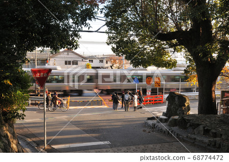Everyday scenery of passing trains at railroad crossings 68774472
