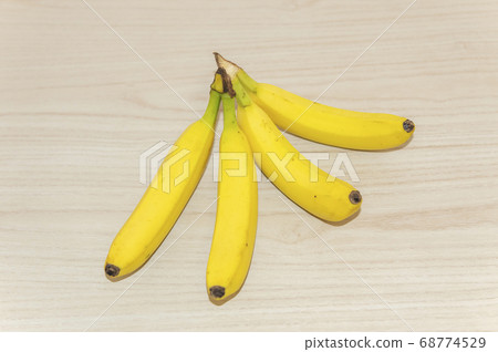Bananas placed on the table 68774529