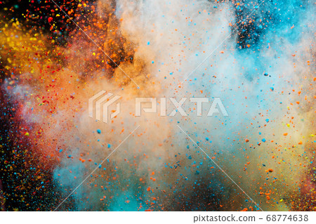 Colored powder explosion on black background. 68774638