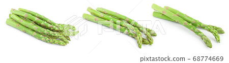 Fresh sprouts of asparagus isolated on white background. Set or collection 68774669