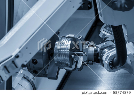 The hi-technology CNC lathe machine operation . The hi-technology CNC lathe machine operation . 68774879