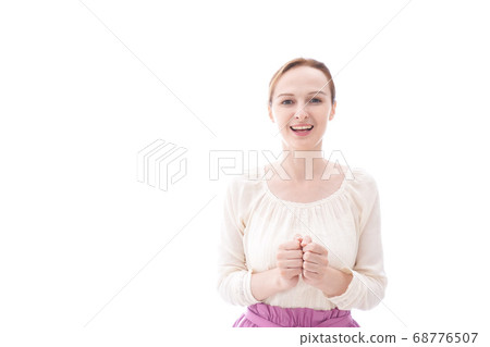 Smiling young woman overjoyed 68776507