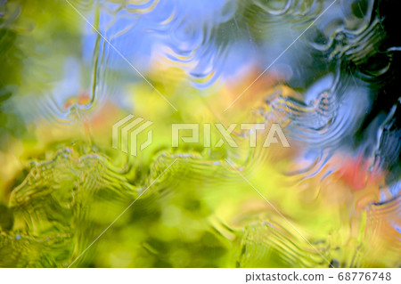 Looking up at the blue sky from the bottom of the water 68776748