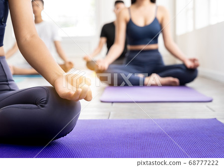 Close up Asian sporty people practicing yoga in 68777222