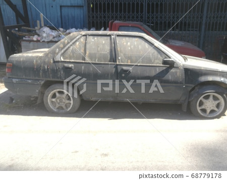 The Garbage in a  car on a street 68779178