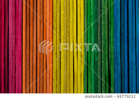 Coloured Wooden Sticks Stacked Side by Side 68779212