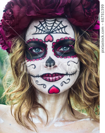 Halloween makeup woman of Santa Muerte outdoors Halloween makeup woman of Santa Muerte outdoors 68781399