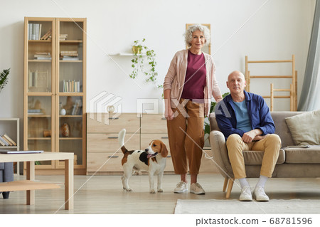 Senior Couple with Dog at Home Senior Couple with Dog at Home 68781596