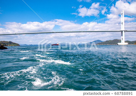A ship sailing with the Seto Inland Sea Shimanami Kaido/Kurushima Kaikyo Bridge A ship sailing with the Seto Inland Sea Shimanami Kaido/Kurushima Kaikyo Bridge 68788891
