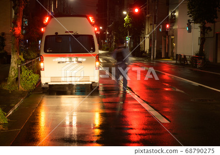 Ambulance at midnight when it rains 68790275