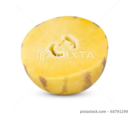 half pepino melons on a white half pepino melons on a white 68791299