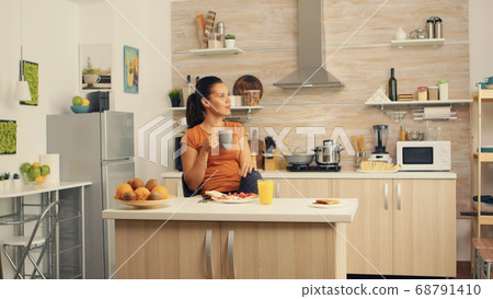 Relaxing and drinking coffee Relaxing and drinking coffee 68791410