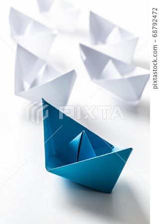 Blue and white paper boats. Concept of leadership 68792472