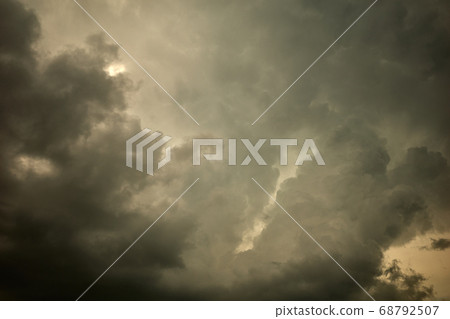 Cloudy sky with gray and yellow fluffy cumulous clouds 68792507