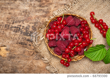 fresh raspberries and currant fruits in a bowl 68793300