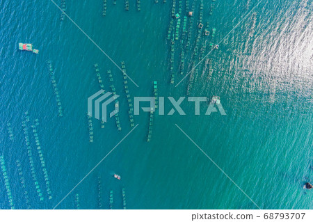 Lots of marine farms in a blue sea water. Sea farming concept 68793707