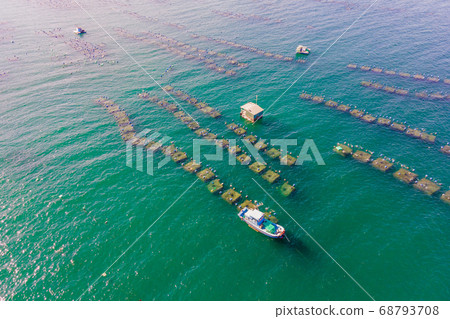 Lots of marine farms in a blue sea water. Sea farming concept 68793708