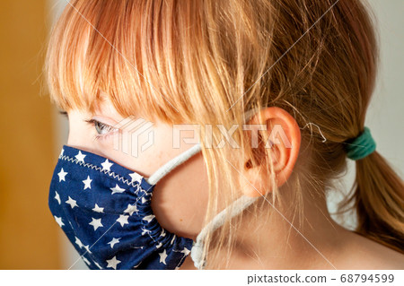 Close up of girl wearing a mask during the pandemic 68794599