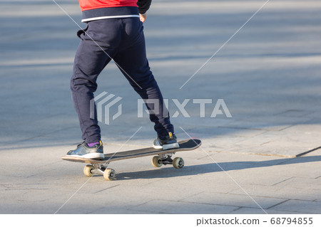 happy children skateboarding on fresh air, healthy 68794855