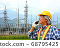 the engineer using the radio communication checking the oparation  system  of power plant 68795425