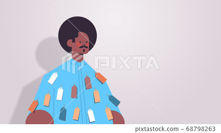 african american man with colorful tags labels on wear inequality racial discrimination concept 68798263