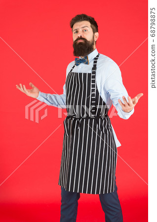 Professional in kitchen. Bearded man chef cooking. Professional in kitchen. Bearded man chef cooking. 68798875