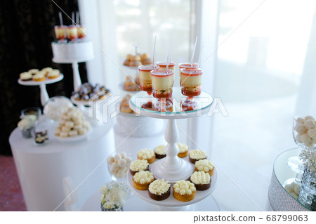 Tasty sweets and desserts on candy bar. Tasty sweets and desserts on candy bar. 68799063