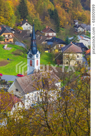 Church in Slovenian village, autumn trees Church in Slovenian village, autumn trees 68800999