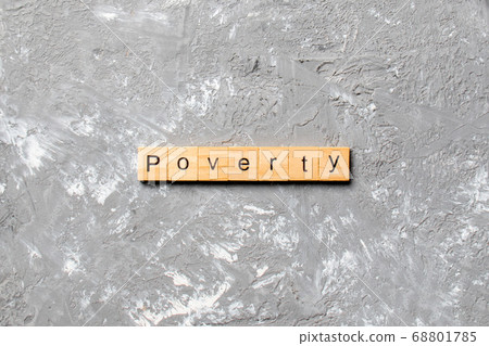 Poverty word written on wood block. Poverty text Poverty word written on wood block. Poverty text 68801785