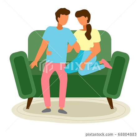 Young family couple sits on the green sofa. Relaxing and staying at home conception. Flat image Young family couple sits on the green sofa. Relaxing and staying at home conception. Flat image 68804883
