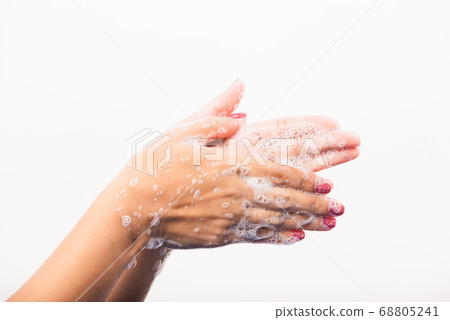 Woman washing hands by soap for cleanliness 68805241