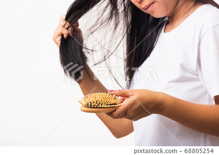 Woman weak hair her hold hairbrush with damaged 68805254