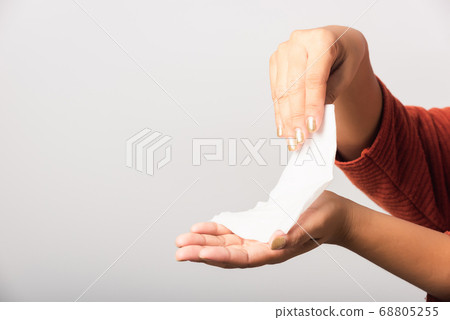 woman she using wet tissue paper wipe cleaning her 68805255