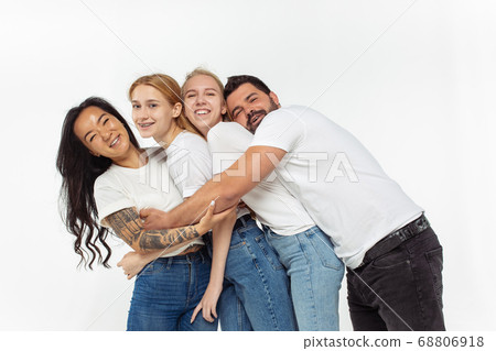 Group of adorable multiethnic friends having fun isolated over white studio background 68806918