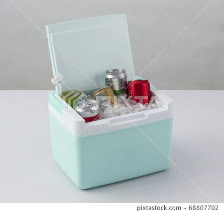 Opened green cooling box with bottles of beverage Opened green cooling box with bottles of beverage 68807702