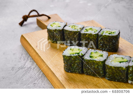 Small rolls with cucumber, avocado and cheese Small rolls with cucumber, avocado and cheese 68808706