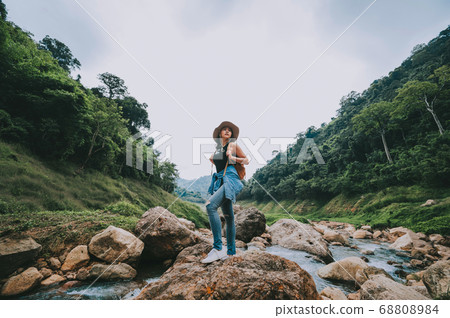 Traveler woman relaxing and enjoying view of Traveler woman relaxing and enjoying view of 68808984