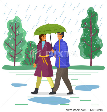 Happy man and woman are walking in city park under an umbrella, go on the background of green trees 68808989