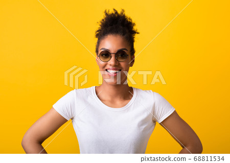 Smiling black lady looking at camera in sunglasses 68811534