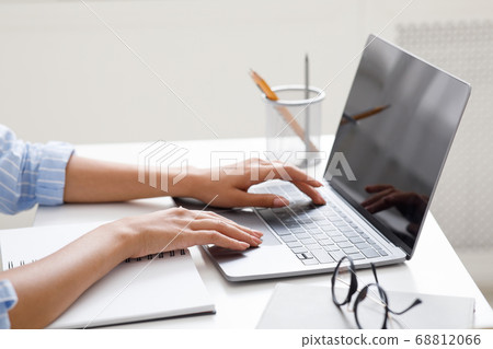 Hobby, work and study online. African american girl typing on laptop at workplace Hobby, work and study online. African american girl typing on laptop at workplace 68812066