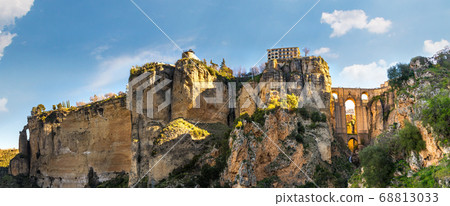 Ronda, Spain: Landscape of white houses on the green edges of steep cliffs Ronda, Spain: Landscape of white houses on the green edges of steep cliffs 68813033