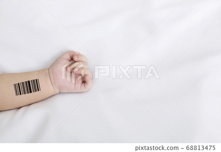 Genetic engineering and cloning. Newborn baby with barcode lying on white sheet, closeup. Collage with copy space Genetic engineering and cloning. Newborn baby with barcode lying on white sheet, closeup. Collage with copy space 68813475