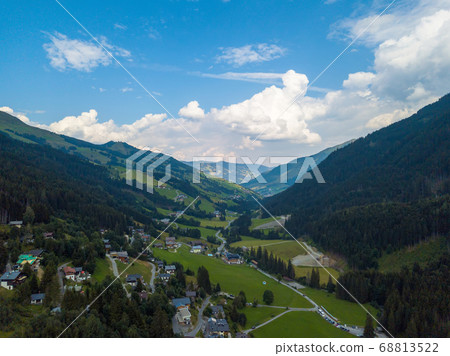 Aerial view from the valley head of the Hinterglemm Mountains to Hinterglemm and Saalbach on a summer day in the Alps at Saalbach-Hinterglemm, Austria 68813522