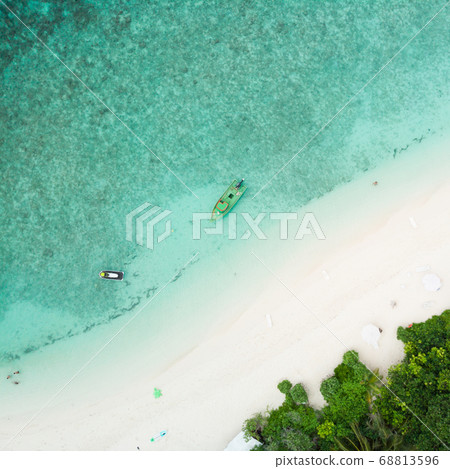 Aerial drone view of picture perfect beach and turquoise lagoon on small tropical island on Maldives Aerial drone view of picture perfect beach and turquoise lagoon on small tropical island on Maldives 68813596