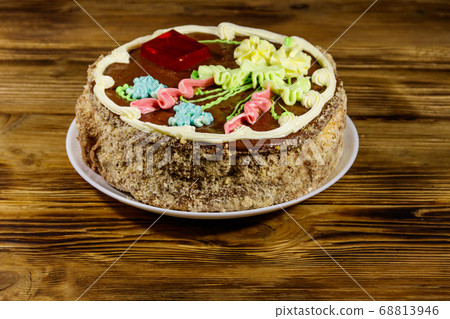 Kiev cake with cream, nuts and meringue  68813946