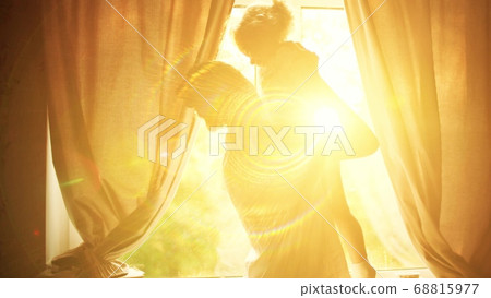 Mom holding and hugging her smiling little daughter near the window at home. Happy family time Mom holding and hugging her smiling little daughter near the window at home. Happy family time 68815977